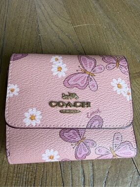 Coach Small Trifold Wallet featuring a lovely butterfly and daisy print